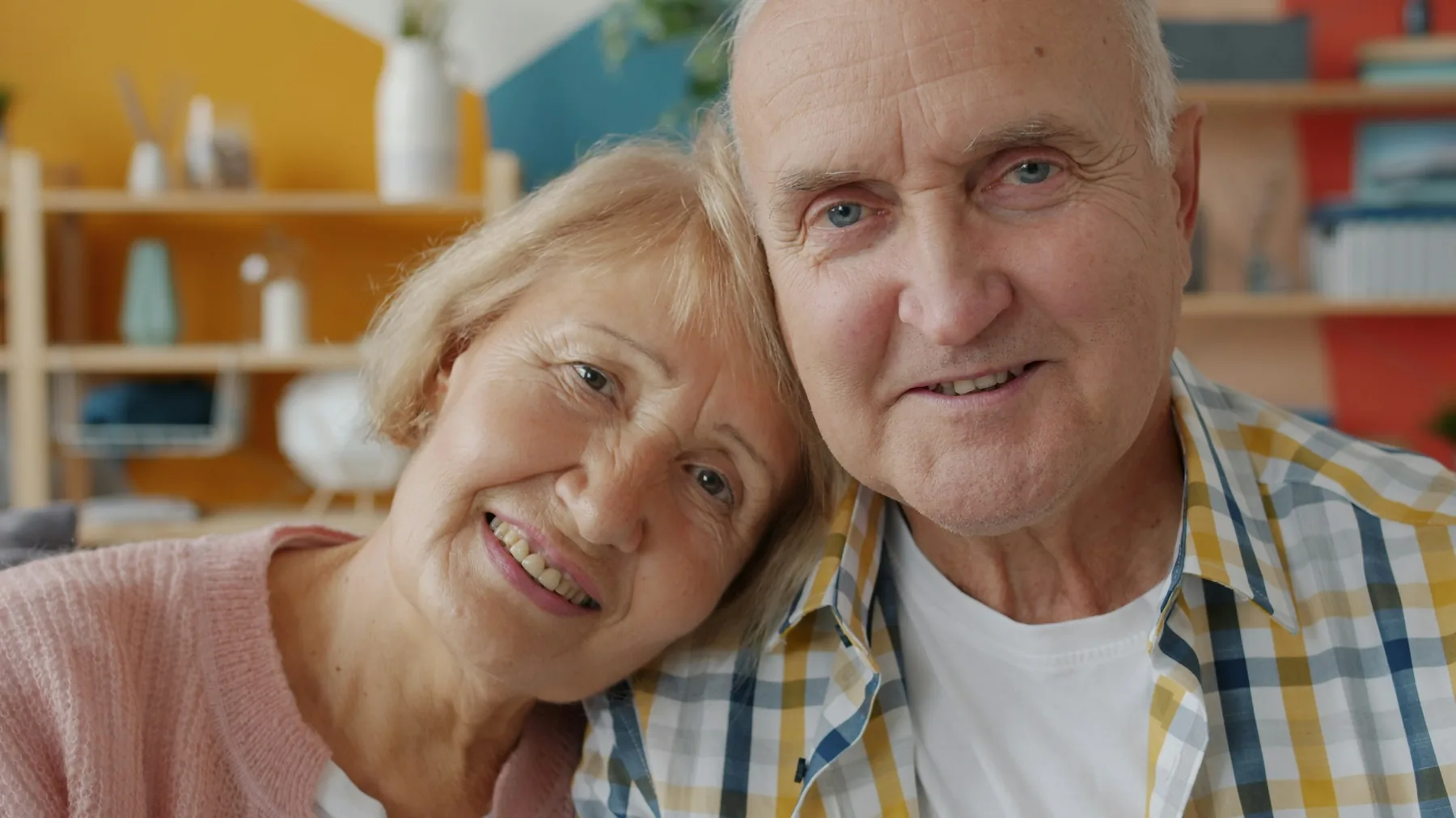 Mature couple smiling together at home